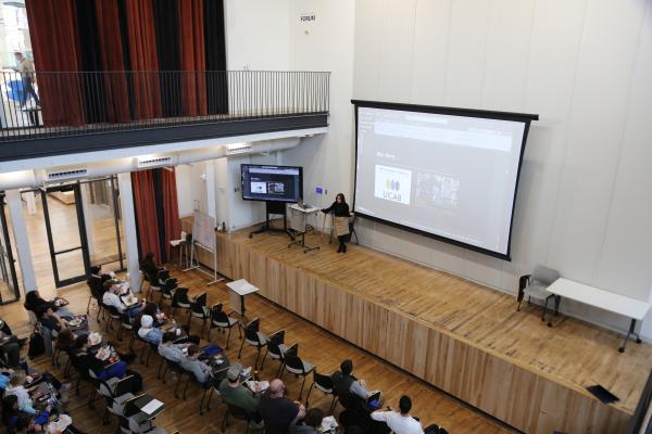 Susana Verni gives lecture on stage in Gray Design Building, 