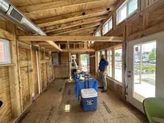 James Blankenship, a May 2025 graduate, provided tours of the interior of the build. Photo by Meg Mills.