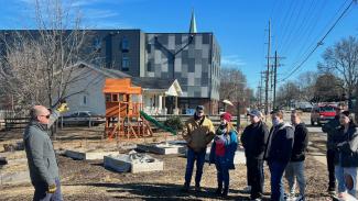 student group touring a housing development