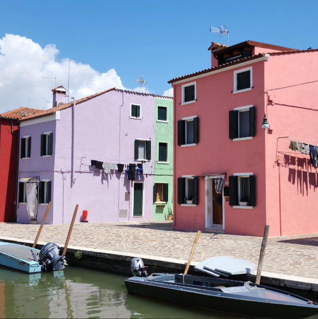 Photo of colorful buildings on Burano, an island in the Venetian Lagoon.,
