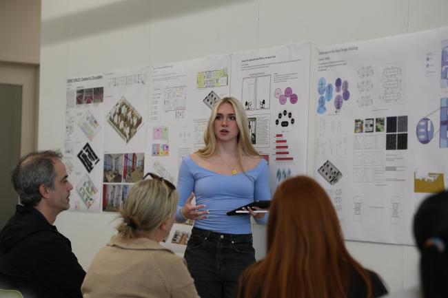 In:Access Studio student Sydney Weibl presents her recommendations on how to make pathways in the Gray Design Building more accessible to an audience of peers, faculty and professionals during final reviews. Photo by Haley Simpkins.