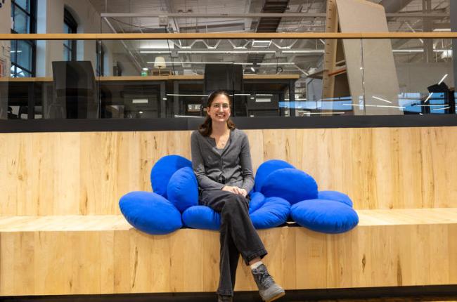 Anna Quarles sitting on her quilted chair. Photo by Bree Walton.